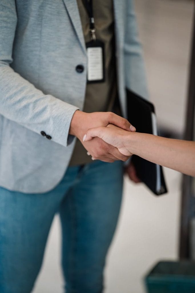 pexels-photo-12903036 Man and Woman during Handshake